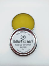 Load image into Gallery viewer, A metal tin with a white label that reads 'No More Night Sweats Salve' containing a yellow balm, on a white background.